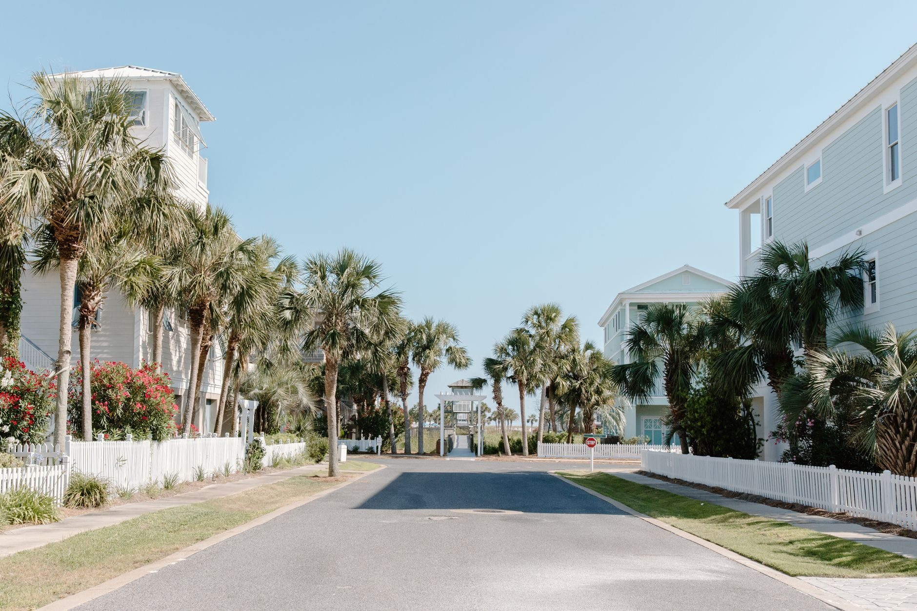 LSV golf carts cruising a sunny Florida residential street, suggesting community-scale fleet use.