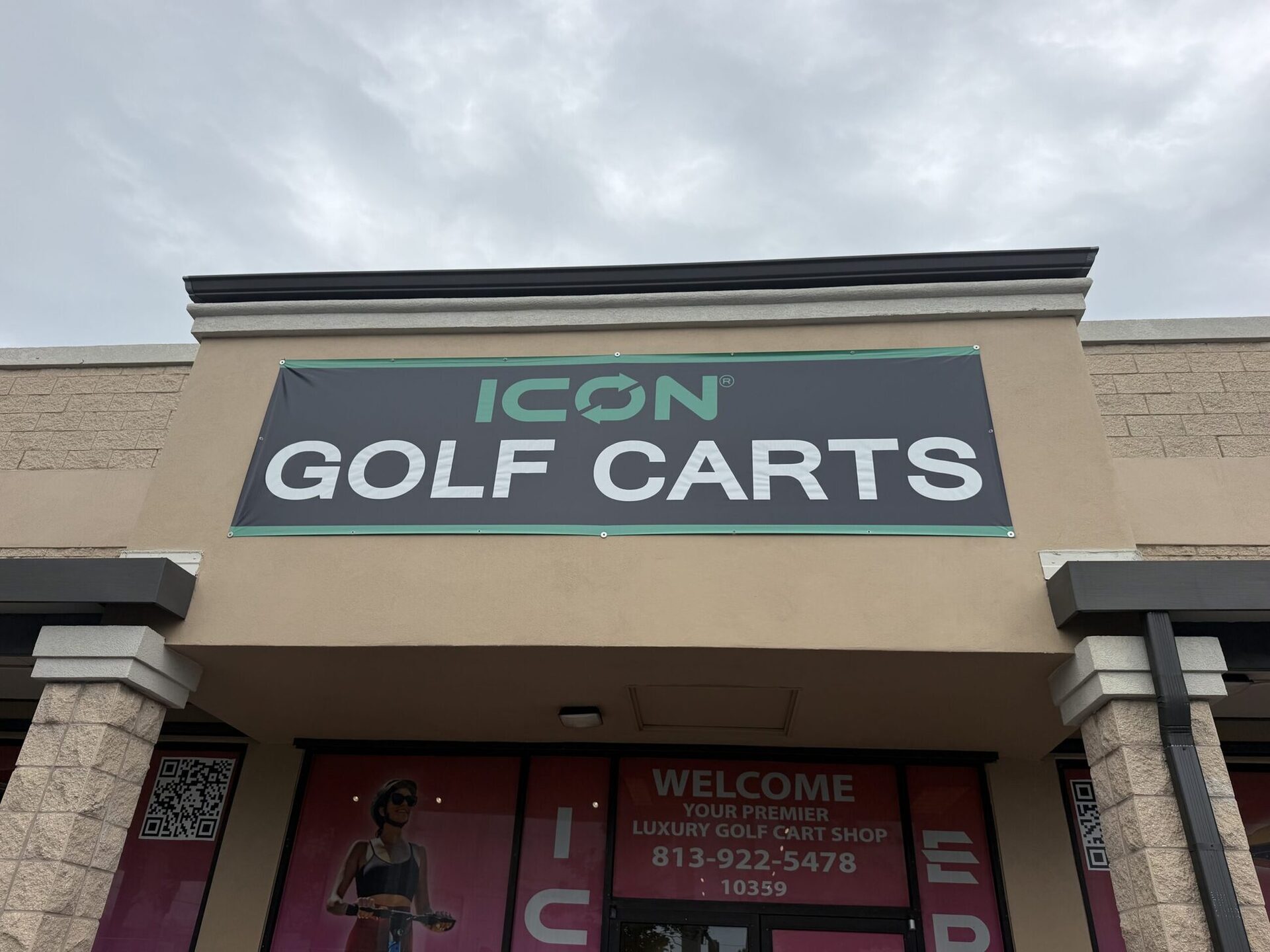 ICON Golf Carts storefront exterior with the charcoal and teal signage banner.